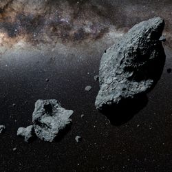 3D renders of several asteroids with the milky way as a back ground