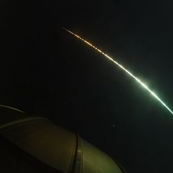 A fish-eye view of the bright streak created by the fireball in the sky
