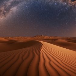 A vast desert under a starry night sky