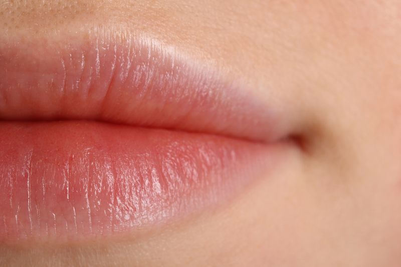 A macro photo showing a close up image of a woman's lips.