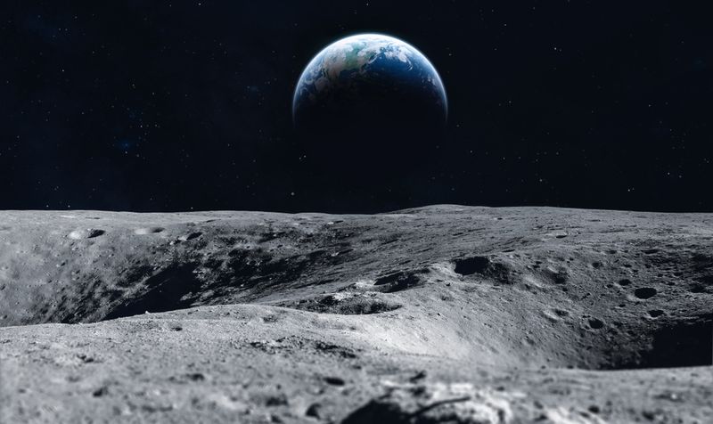 Moon surface with a view of Earth.