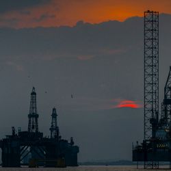 Sunset over the oil rigs of Cromarty Firth on the Scottish coast.