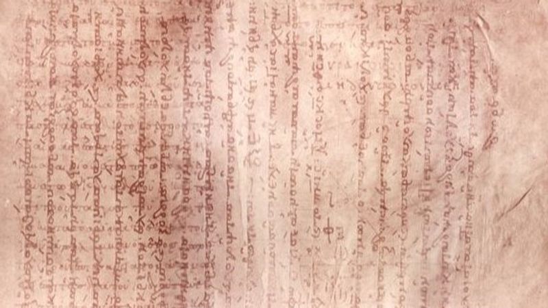 A typical page from the Archimedes Palimpsest. The text of the prayer book is seen from top to bottom, the original Archimedes manuscript is seen as fainter text below it running from left to right