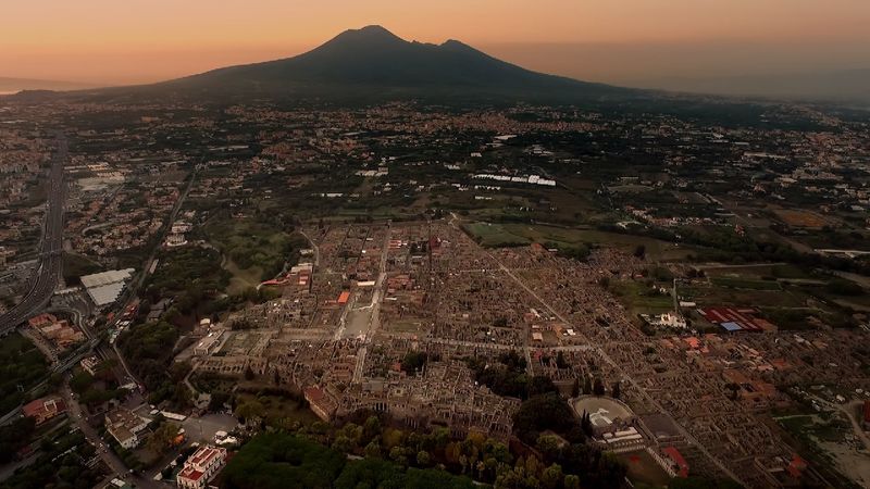 Mount Vesuvius looks over the Archaeological Park of Pompeii near the coast of the Bay of Naples, southern Italy.