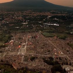Mount Vesuvius looks over the Archaeological Park of Pompeii near the coast of the Bay of Naples, southern Italy.