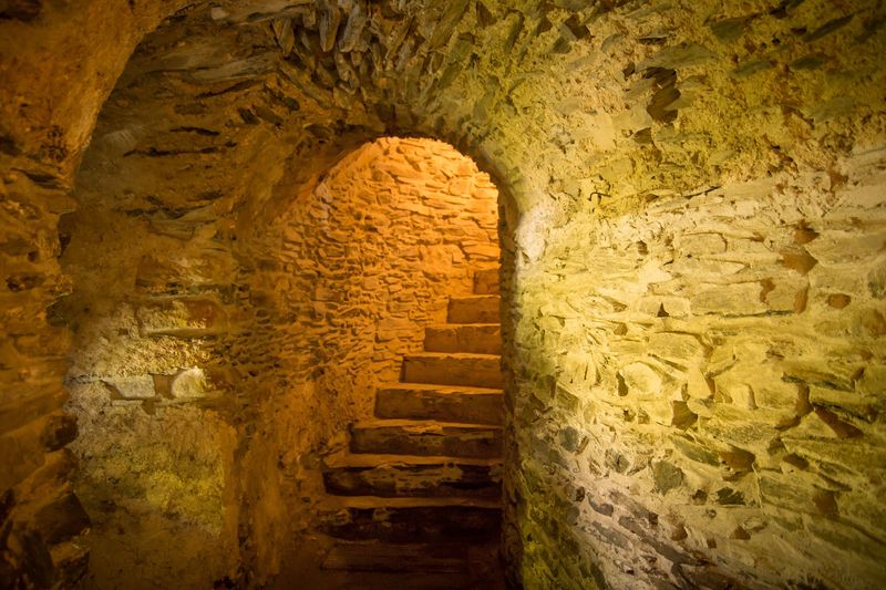 photo of stone staircase that has been flipped horizontally so the stairs appear to be twisting in an anticlockwise direction