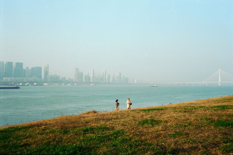 A Bridge in Wuhan, China, crosses over the Yangtze River near cities