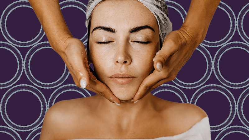 photograph of a woman getting her face massaged