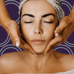 photograph of a woman getting her face massaged