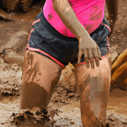 Marathon runners in mud.