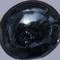 A black, shiny blob of osmium.