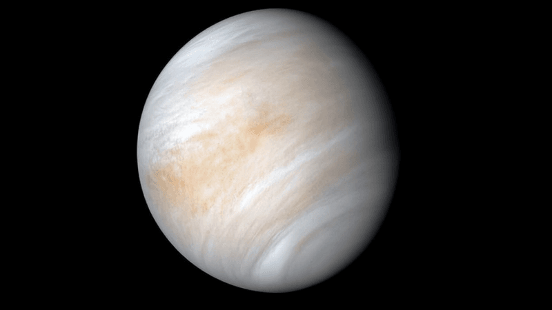 Venus is is completely covered in long hing turbulent clouds in this view showing most of the planet's disk