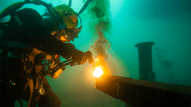 A diver welding underwater.