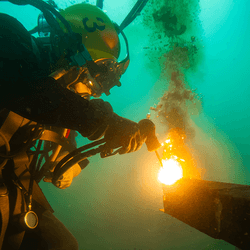 A diver welding underwater.